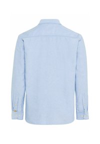 Lichtblauwe blouse met lange mouwen, rechte zoom, knoopmanchetten en een kleine kraag. Gemaakt van een gestructureerde stof met minimale details.