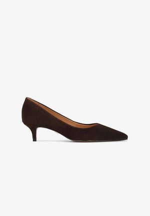 Brown suede pump with a pointed toe, low heel, and smooth interior lining. Features a sleek design with minimal accents.
