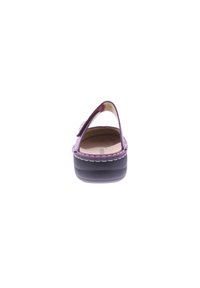 Purple leather sandal with an open back, thick black sole, and white stitching detail on the edge. Smooth texture and simple design.