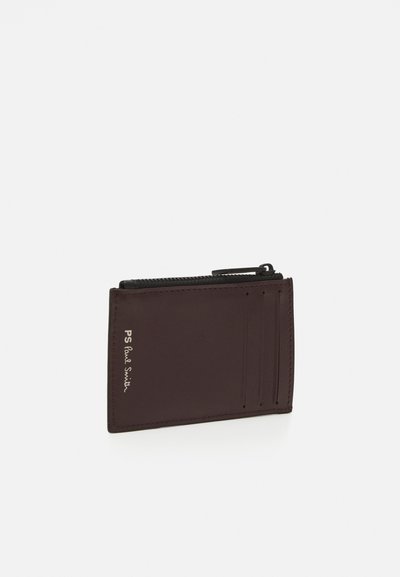 Brown leather wallet with four card slots, a zippered compartment, and embossed logo detail on the front. Smooth texture, sleek design.