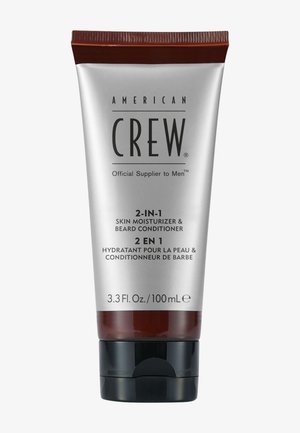 American Crew 2 w 1 nawilżacz do skóry i odżywka do brody w srebrno-brązowej tubce o pojemności 3,3 fl oz z czarną zakrętką.