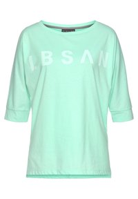 Mint green short-sleeve shirt with a wide neckline and rolled cuffs, featuring bold white letters "LBSAN" across the front. Cotton material.
