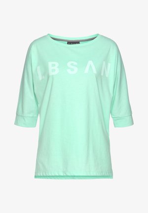 Mint green short-sleeve shirt with a wide neckline and rolled cuffs, featuring bold white letters "LBSAN" across the front. Cotton material.