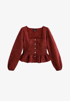 Rote strukturierte Bluse mit langen Puffärmeln, quadratischem Ausschnitt, fünf Knopfverschluss und Peplum-Saum. Das Material hat ein zerknittertes Muster.