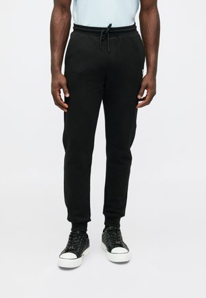 PANTS - Verryttelyhousut - black