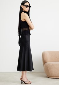 DRYKORN NEVIDA - Maxi skirt - black