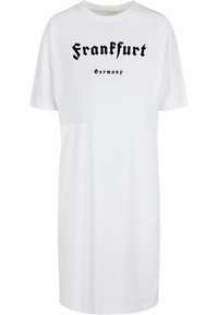 Fehér pamut pólóruha, fekete "Frankfurt Németország" felirattal, gótikus betűtípussal. Rövid ujjú, laza, egyenes szabású dizájnnal.