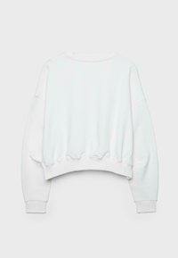 Sweat-shirt court blanc à manches longues, avec poignets côtelés et ourlet légèrement froncé, vu de dos sur un fond uni.