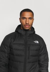 The North Face ACONCAGUA HOODIE - Casaco de penas - black