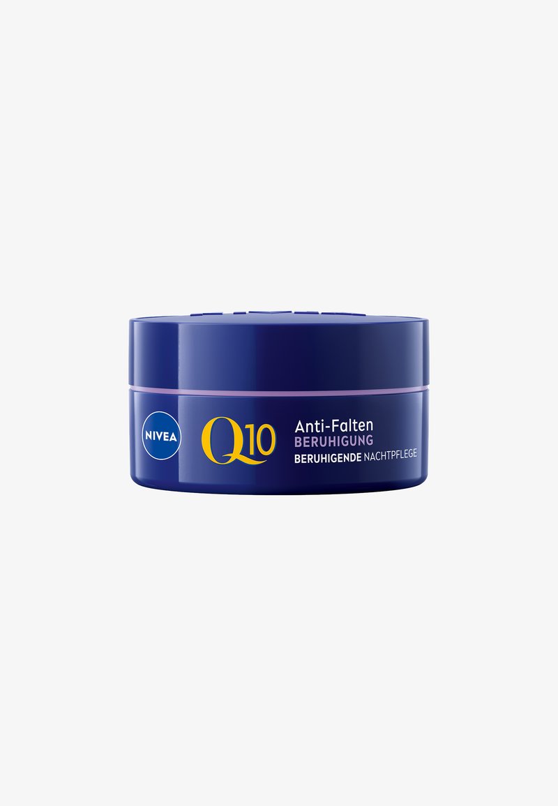 Nivea Q10 night cream in a round, navy blue container. Features a light purple band and yellow text, labeled "Anti-Falten Beruhigung."