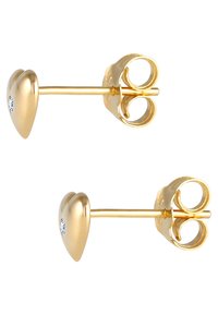 Goldene, herzförmige Steckerohrringe mit einem kleinen klaren Edelsteinakzent. Glatte Oberfläche und eine sichere Schmetterlingsverschluss.