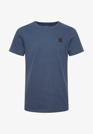 Navy blue short-sleeve T-shirt made of soft cotton, featuring a crew neck and a small textured logo patch on the front.
