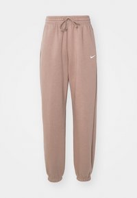 Mauve-colored Nike sweatpants with elastic cuffs, drawstring waistband, and white Nike swoosh logo on left thigh.