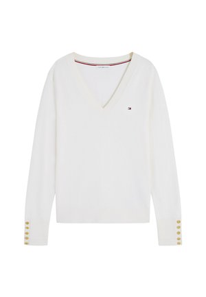 Pull blanc à col en V manches longues avec petit logo sur la poitrine et six boutons dorés sur chaque manchette, présenté sur un fond uni.
