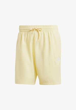 Lichtgele shorts met een elastische tailleband en een trekkoord. Voorzien van een wit logo aan de onderkant rechts. Glad, lichtgewicht stof.
