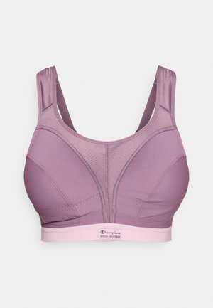 Lilla sports-BH med jevn tekstur, brede stropper og forsterket bånd. Har sømdetaljer og en logo på båndet.