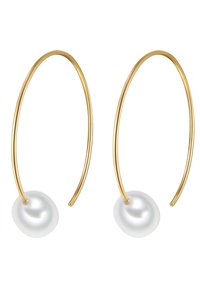 Zelta riņķa auskari ar gludu, baltu pērļu akcentu pie pamatnes un minimālistisku, izstieptu dizainu.