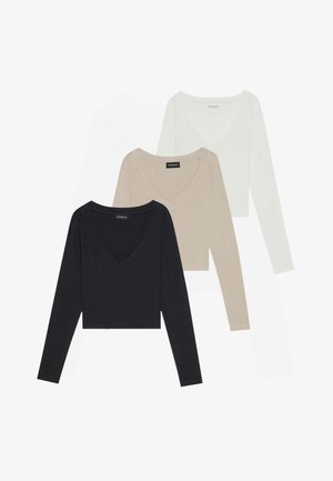 Drei langärmlige V-Ausschnitt-Oberteile in Schwarz, Beige und Weiß. Der Stoff ist glatt und weich und weist ein figurbetontes, kurzes Design auf.