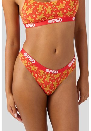 Rotes Unterwäsche-Set mit einem Lebkuchenplätzchen-Muster. Weicher Stoff mit einem elastischen Bund mit Logo. Tanga-Design mit minimaler Bedeckung.