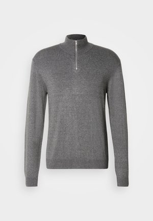 Halli kudumisvarsakook kõrge kraega ja lühikese tõmblukuga. Omab pikki varrukaid ja keha järgivat disaini, valmistatud pehmest, tekstuuriga kangast.