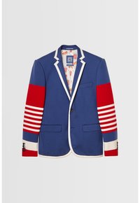 Blazer bleu avec bordure blanche, bandes rayées rouge et blanc sur les manches, poches avant et doublure intérieure avec imprimé popcorn et hot-dog.