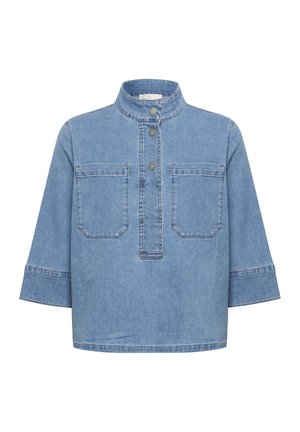 Light blue denim shirt with a stand-up collar, two front pockets, and a half-button placket. Features wide three-quarter sleeves.