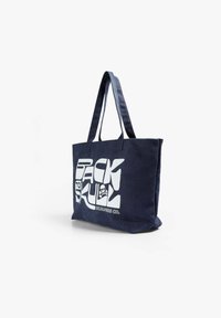 Sac de toile bleu marine avec deux poignées, arborant un grand texte blanc qui indique "BACK TO SKULL" et un graphique de crâne. Conception durable et spacieuse.