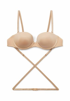 Beige gevormde bh met dunne verstelbare bandjes, beugel en een kruisrugontwerp. Gladde textuur met een haak-en-oogsluiting.