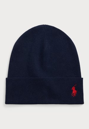Beanie in maglione blu navy con risvolto, dotato di un piccolo logo ricamato di un giocatore di polo rosso sul lato.