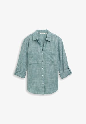 Jasnozielona koszula na guziki wykonana z tkaniny o wzorze w kratę. Posiada kołnierzyk, długie rękawy oraz luźny krój.