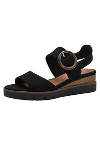 Sandali con zeppa nera caratterizzati da tomaia in morbido suede, design a fascia larga, accent decorativo circolare e soletta in legno texturizzato.