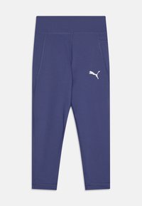 Tengerészett kék aktív leggings, testhez álló kialakítással, rugalmas anyagból készült. A bal combon egy fehér Puma-logó található, valamint oldalsó zsebekkel rendelkezik.