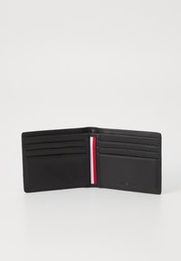 Black leather wallet with multiple card slots and a red and white stripe accent. Smooth texture, functional design, open view.