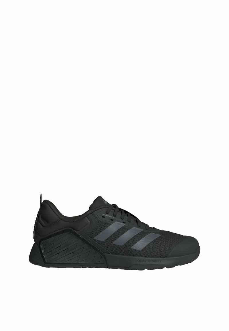 Scarpa sportiva nera con tomaia in rete, tre strisce grigie e suola testurizzata. Presenta un tallone rinforzato e un design con lacci per una vestibilità sicura.
