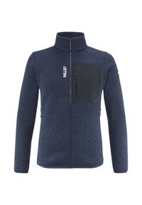 Veste en polaire marine avec un col haut, une poche poitrine zippée et deux poches latérales. Caractéristiques : tissu texturé et motifs ton sur ton subtils.