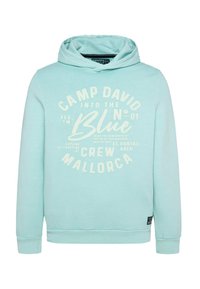 Sudadera de color azul claro hecha de una mezcla de algodón, con un estampado gráfico en la parte delantera que incluye texto. Bolsillo canguro y puños acanalados. Textura suave.