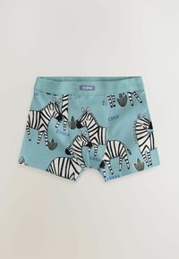 Boxer in cotone blu con motivi a strisce zebrate bianche e nere, accentuati da fogliame verde e una cintura viola etichettata "ZEBRA."