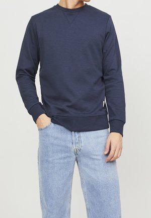 Sweat-shirt bleu marine en tissu mélangé de coton, doté d'un col rond, de poignets côtelés et d'un ourlet inférieur droit.