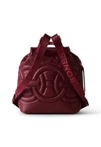 Burgundy leather backpack with embossed circular design and "BORBONESE" text on adjustable straps, gold zipper detail on side.