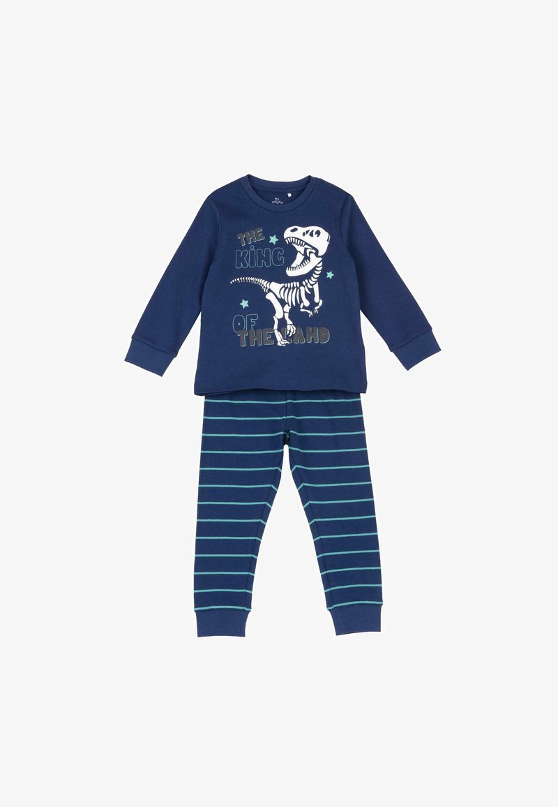 Haut à manches longues bleu marine avec squelette de dinosaure blanc et texte « The King of the Land », associé à un pantalon rayé bleu marine avec des lignes bleu clair.