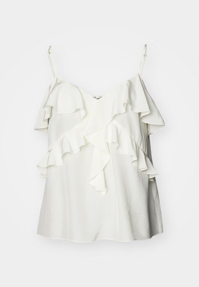 Valge ilma varrukateta topp, mis on valmistatud kergest kangast, featuring kihilised volangid esiküljel ja reguleeritavad rihmad mugavuse ja sobivuse tagamiseks.