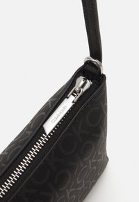 Calvin Klein MUST - Cross body bag - black