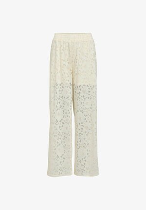 Pantalon large couleur crème avec motif en dentelle florale et taille élastique, semi-transparent à partir du milieu de la cuisse vers le bas.