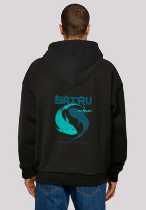 Black hoodie featuring a graphic of two fish in blue and teal swirling together, with the text "SAITRU urban" below. Soft fabric with a relaxed fit.