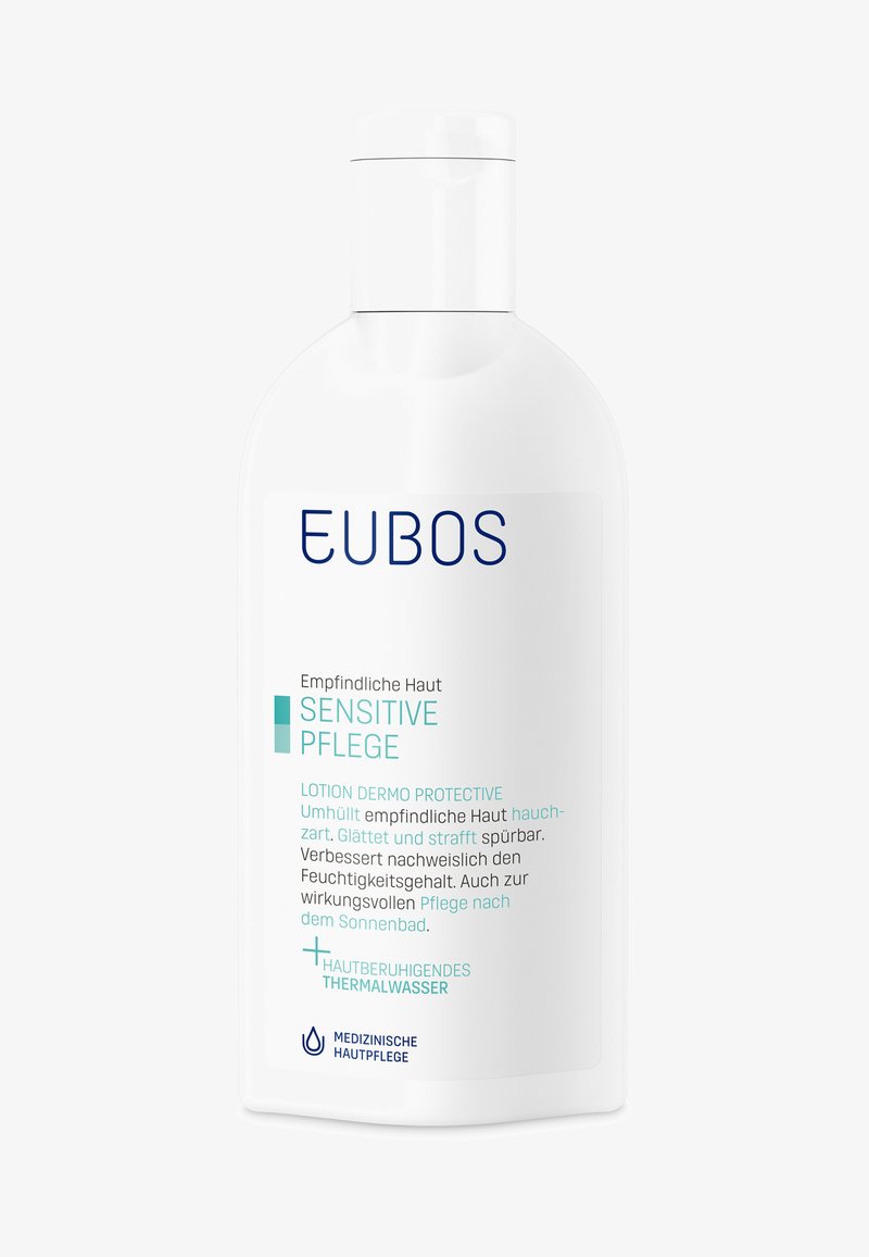 White bottle of EUBOS Sensitive Pflege lotion for sensitive skin with German text describing protective, moisturizing skin care with thermal water.