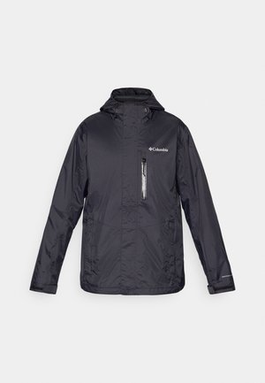 Chaqueta de lluvia ligera negra con capucha, bolsillo en el pecho con cremallera y logo de Columbia en la parte superior izquierda. Textura de tela suave y duradera.