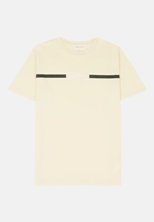 Cream t-shirt made of cotton, featuring a crew neckline, short sleeves, and a horizontal black and white graphic band with text.