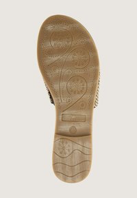 La suola del sandalo presenta una gomma beige testurizzata con motivi decorativi, tra cui cerchi e onde. Marchiata con "TOM TAILOR" e taglia 40.