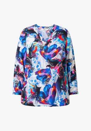 Haut à manches longues coloré avec un col en V, présentant un design floral vif en bleu, violet, rouge et noir sur un fond blanc.