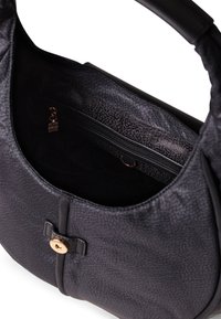 Black leather handbag with a textured finish. Features a gold-tone button closure, zip pocket, and interior lining with a faint pattern.